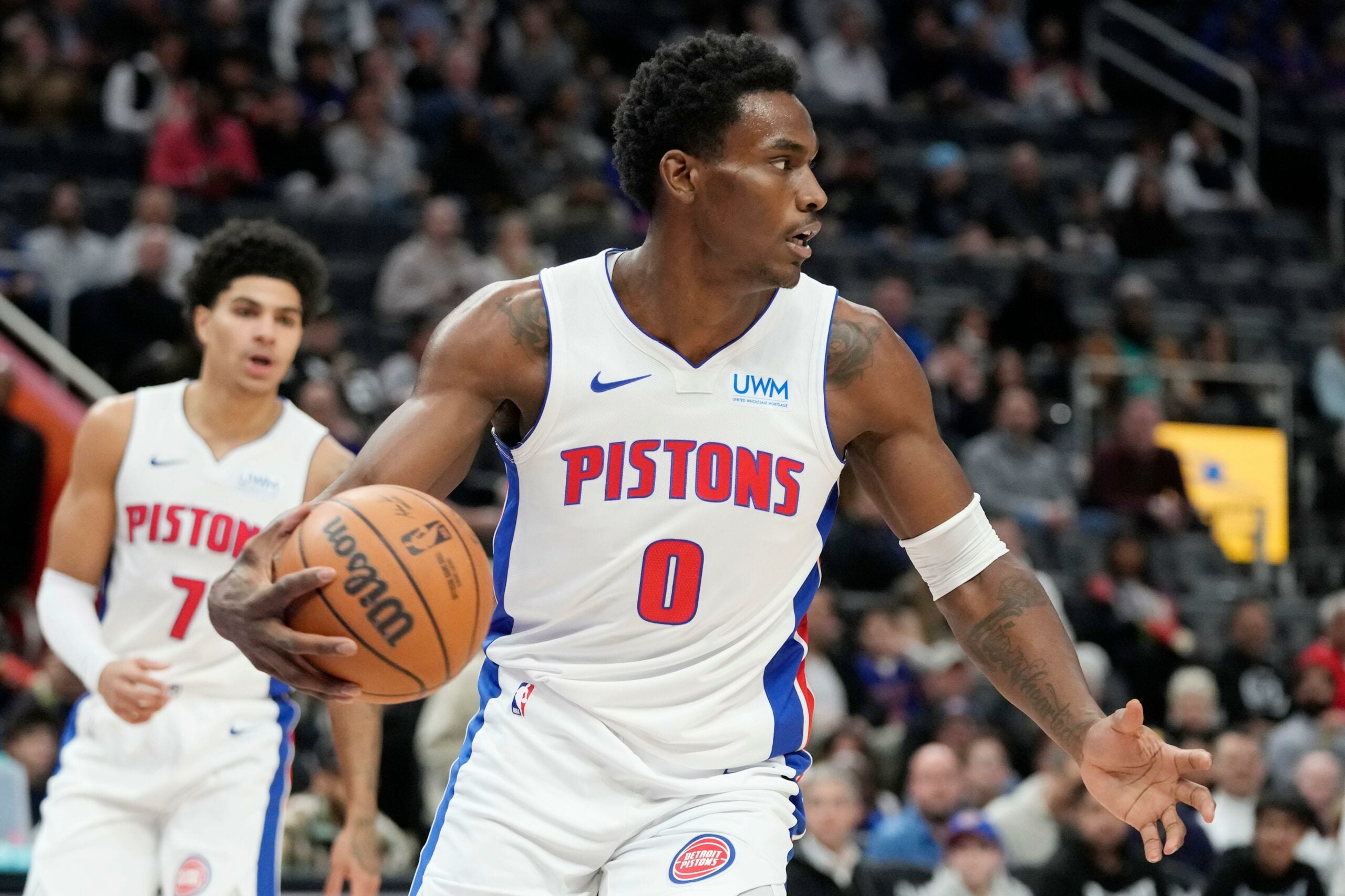 Detroit Pistons center Jalen Duren (0) controls the ball during the first half of an NBA basketball game against the San Antonio Spurs, Wednesday, Jan. 10, 2024, in Detroit. (AP Photo/Carlos Osorio)