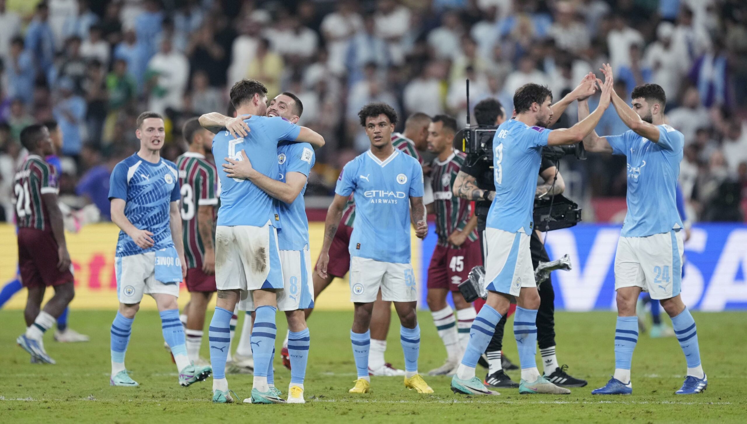Jogadores do Manchester City e Fluminense; Mundial de Clubes
